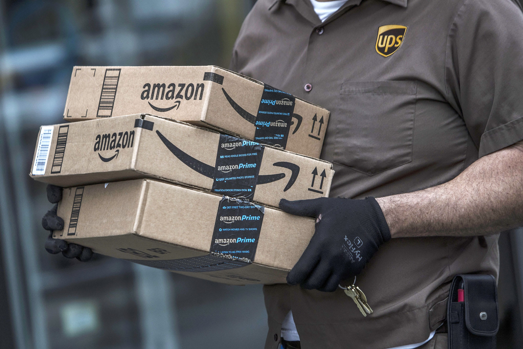 Amazon expands its business while UPS goes under debt